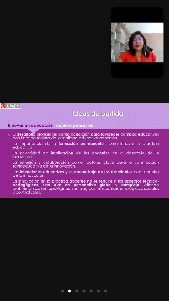 Diapositiva usada durante la conferencia. En el recuadro superior la conferencista explicándola